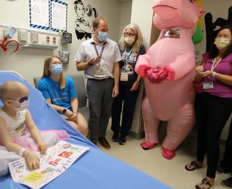 Doctor dresses in pink unicorn outfit and holds "no more chemo" party for four-year-old cancer survivor