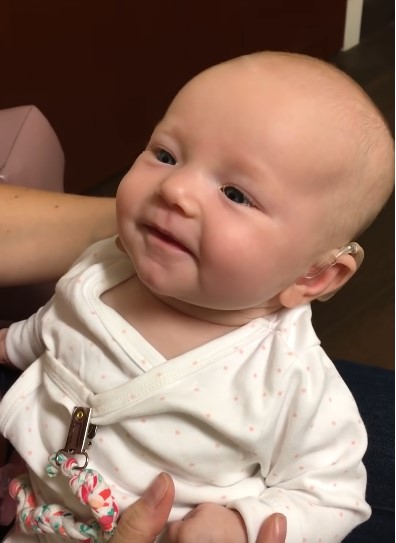 Deaf baby is joyous when she hears mum say "I love you" for the first time