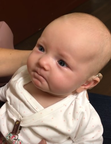 Deaf baby is joyous when she hears mum say "I love you" for the first time