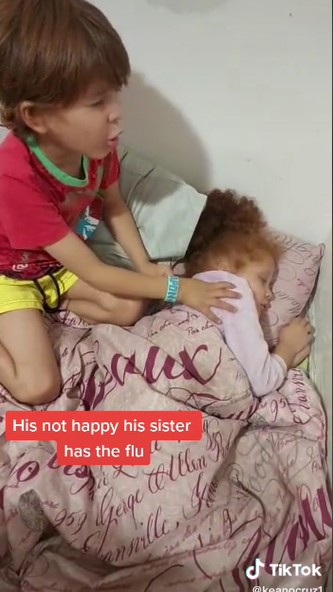 TYoung boy prays for baby sister who is down with flu before going to school