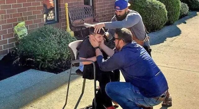 Kind barber takes chair outside so overwhelmed autistic boy can get his new haircut