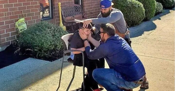 Kind barber takes chair outside so overwhelmed autistic boy can get his new haircut