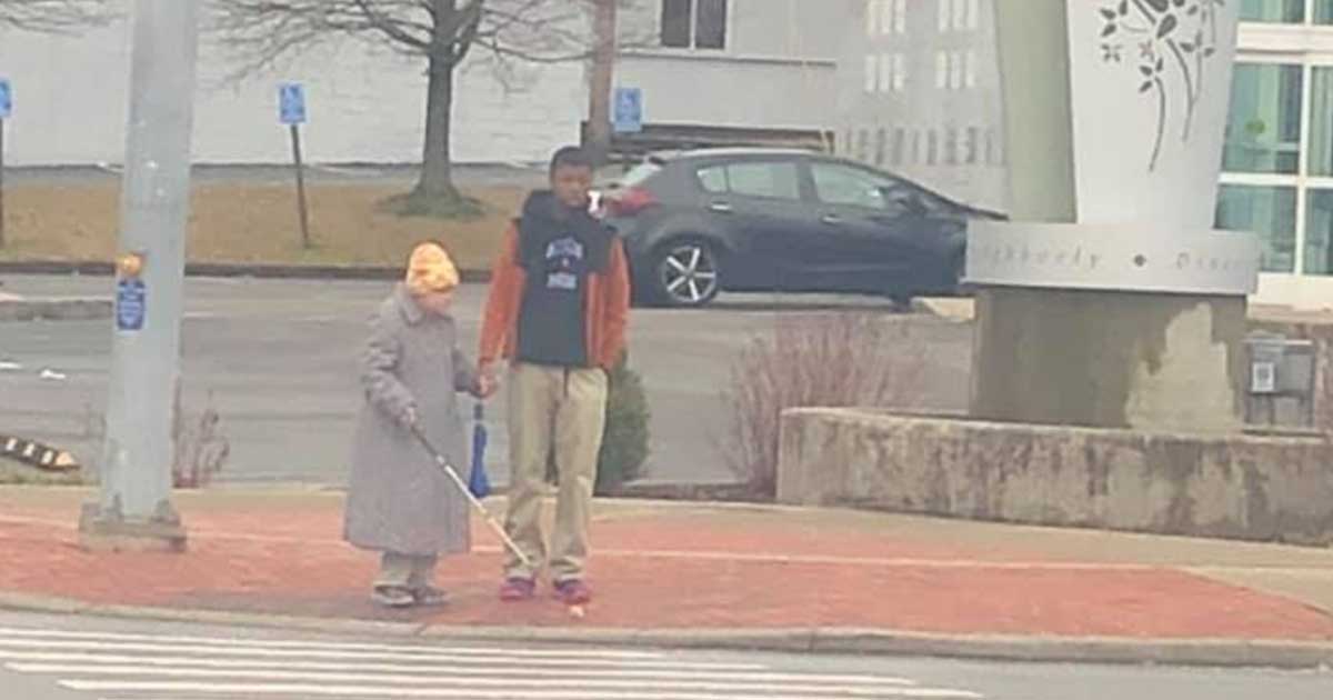 Photo of teen helping an elderly blind woman cross the busy street goes viral— He deserves our recognition