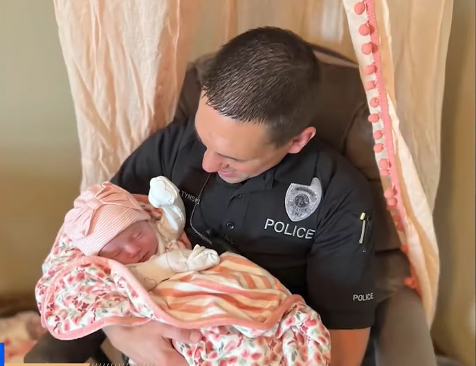 An Indiana police officer adopts a baby after her mother abandons her in a box