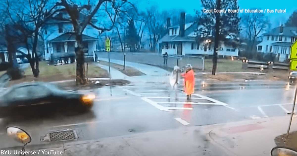 Brave crossing guard risked being struck by a speeding car in order to save a child