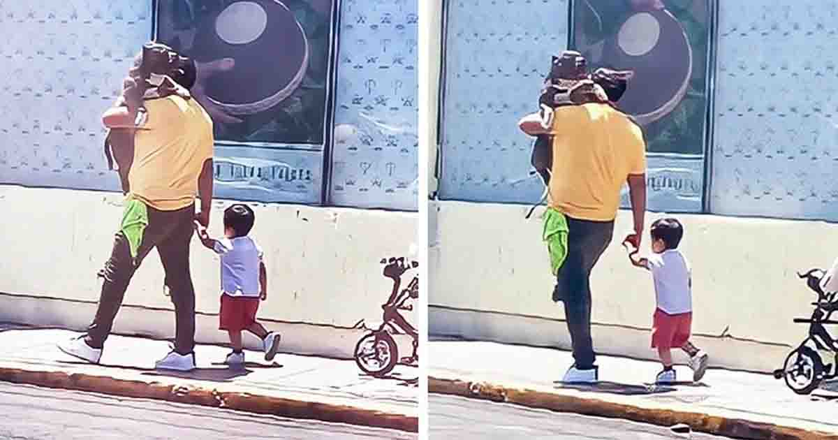 Father gets praised for choosing to carry his large dog instead his little kid