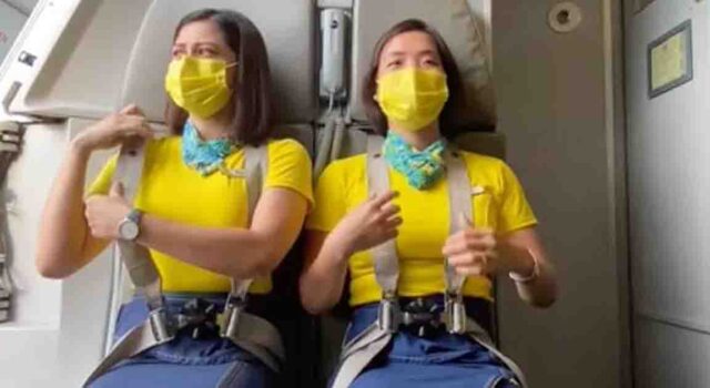 Flight attendant shares a 'scary' explanation for why they sit on their hands during take-off and landing