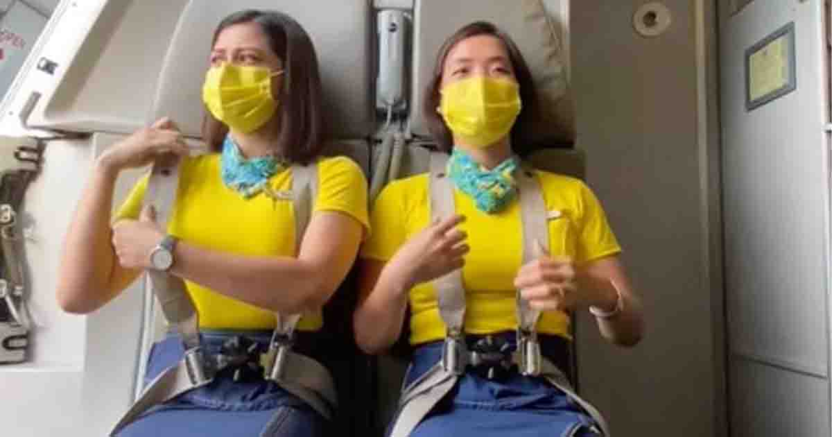 Flight attendant shares a 'scary' explanation for why they sit on their hands during take-off and landing