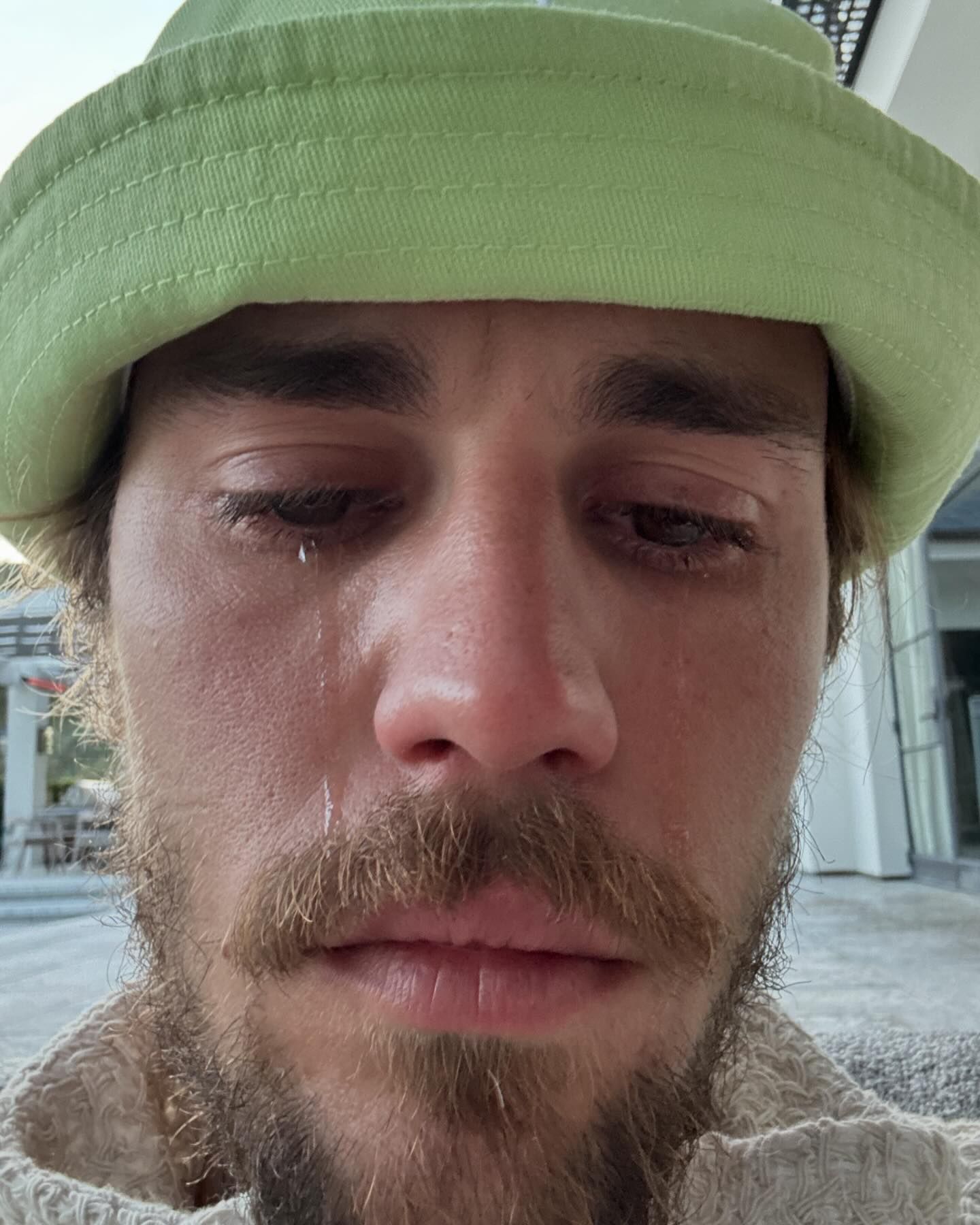Justin Bieber shares photo of himself crying, causing concern among fans, followed by a response from his wife Hailey